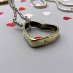 50 BMG Bullet Casing Heart Keychain Necklace in romantic valentines day setting